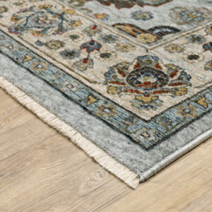 3' X 5' Blue Beige Grey Green Yellow And Rust Oriental Power Loom Stain Resistant Area Rug With Fringe